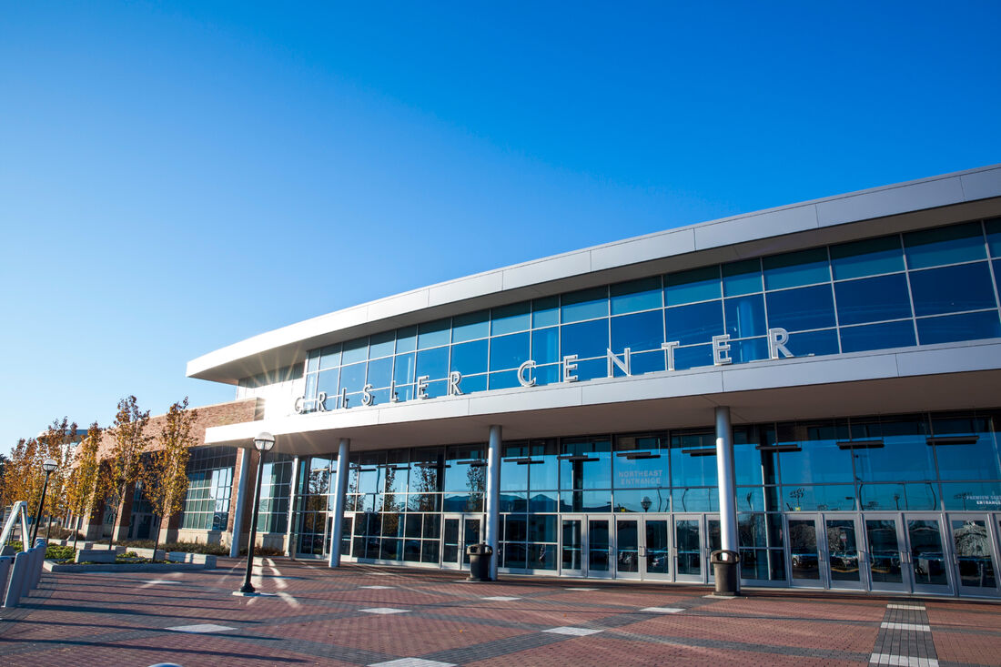 The glass exterior of the entrance to the Crisler Center