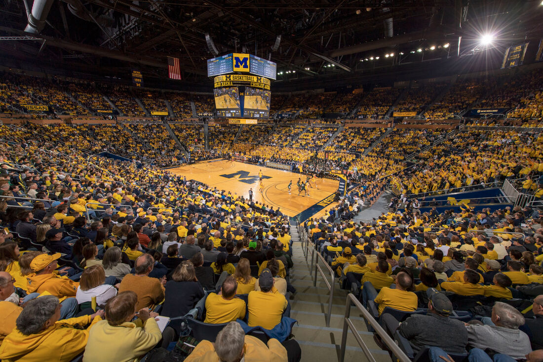 A view of a basketball game at the Crisler Center from the stands