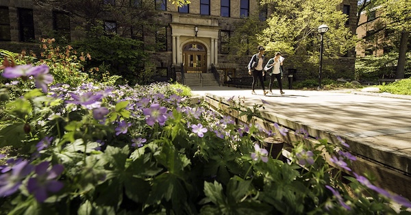 The corner of the four-story Dana Building on a sunny day