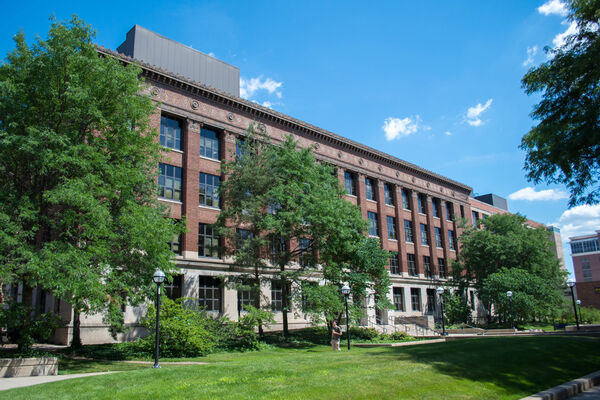 The four-story brick exterior of East Hall on a sunny day