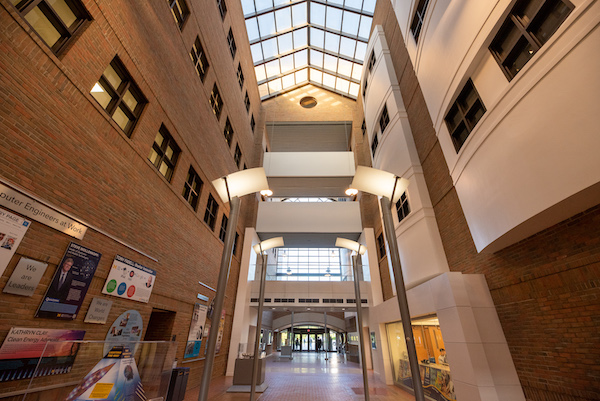 The central two-story brick atrium with a glass ceiling