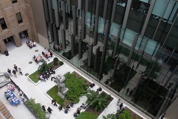 An overhead view of people having an event in a courtyard